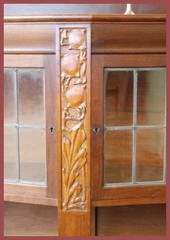 Detail leaded doors & carved panel.